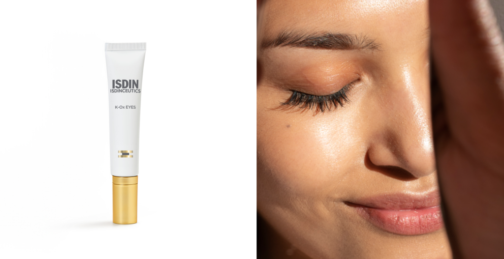 Tubo blanco con tapa dorada de ISDIN K-Ox Eyes junto a un rostro femenino con los ojos cerrados, iluminado por la luz natural.