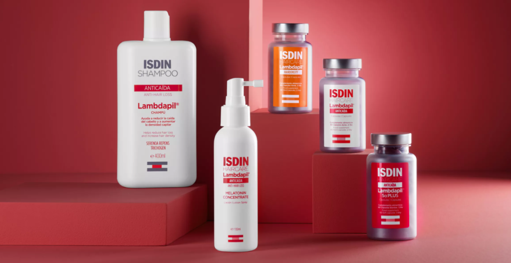 Productos ISDIN Lambdapil para la densidad capilar, incluyendo shampoo, loción con melatonina y cápsulas, diseñados para fortalecer el cabello y combatir la caída.