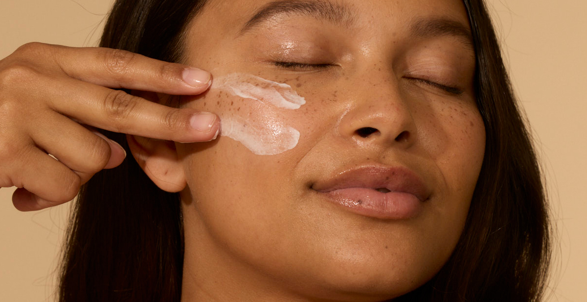 Woman with sunscreen on her face