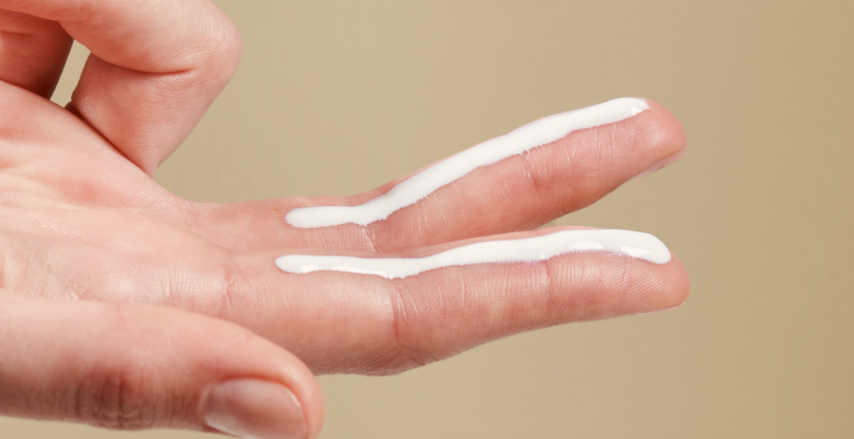 sunscreen on fingers