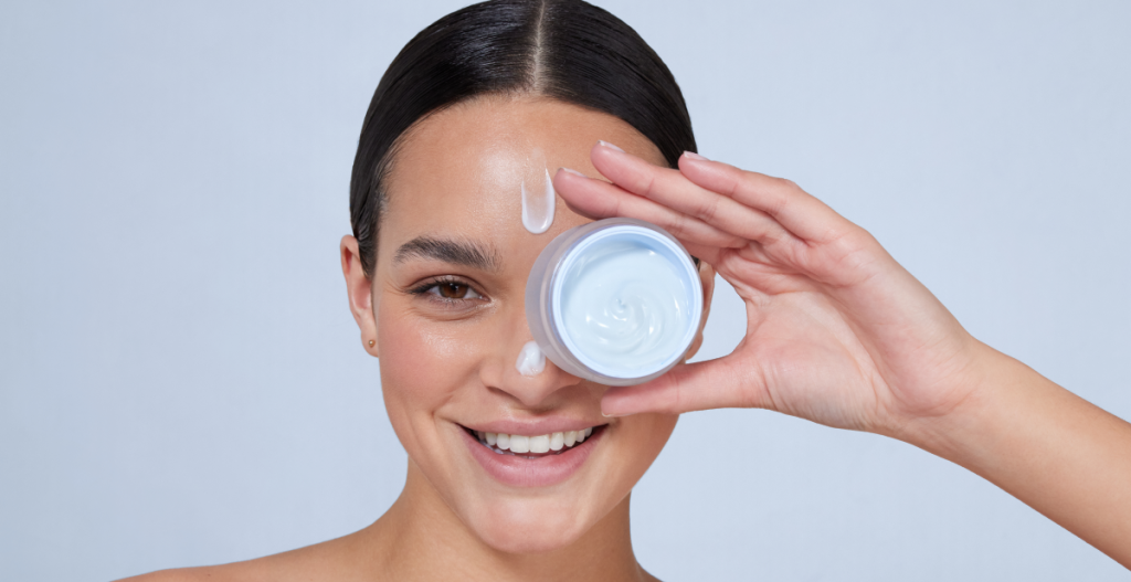 Woman with moisturizer cream