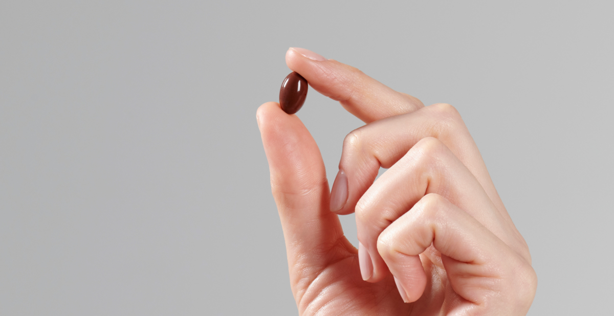 vitamin E skin supplement capsule in hand
